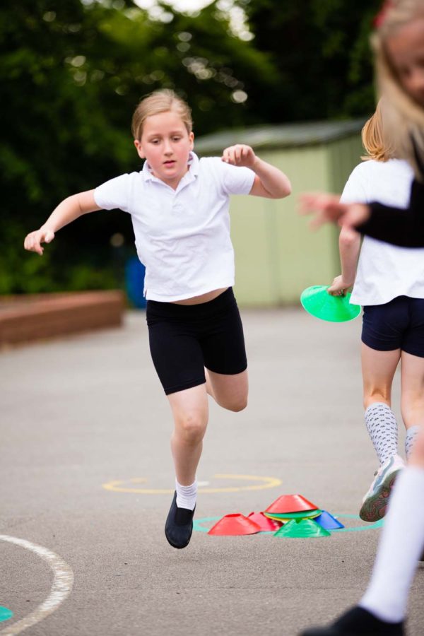 School girl having fun in the playground